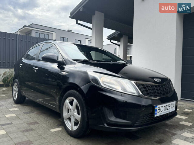 Чорний Кіа Ріо, об'ємом двигуна 1.4 л та пробігом 199 тис. км за 5999 $, фото 11 на Automoto.ua