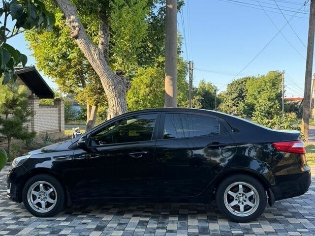 Чорний Кіа Ріо, об'ємом двигуна 1.59 л та пробігом 104 тис. км за 8900 $, фото 1 на Automoto.ua
