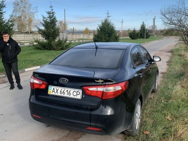 Чорний Кіа Ріо, об'ємом двигуна 1.4 л та пробігом 190 тис. км за 5500 $, фото 3 на Automoto.ua