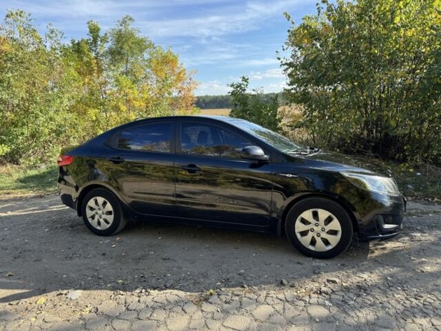 Чорний Кіа Ріо, об'ємом двигуна 1.4 л та пробігом 173 тис. км за 7300 $, фото 3 на Automoto.ua