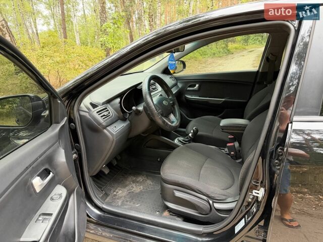 Чорний Кіа Ріо, об'ємом двигуна 1.4 л та пробігом 193 тис. км за 6300 $, фото 4 на Automoto.ua