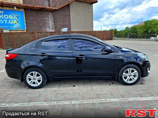 Чорний Кіа Ріо, об'ємом двигуна 14 л та пробігом 96 тис. км за 8600 $, фото 3 на Automoto.ua