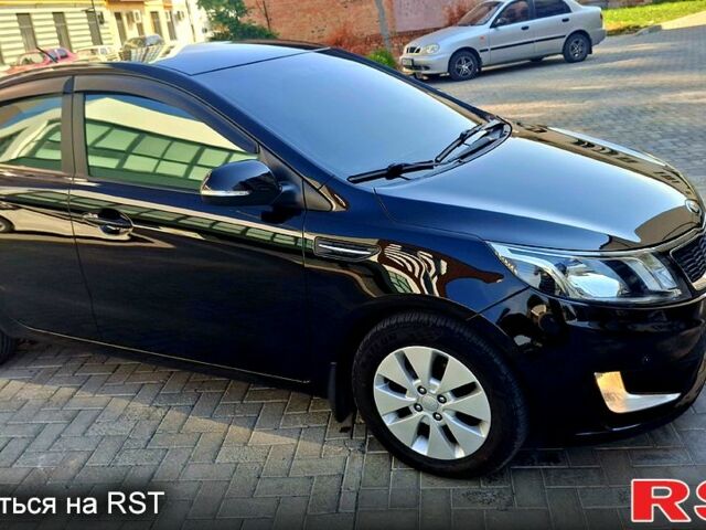 Черный Киа Рио, объемом двигателя 1.6 л и пробегом 130 тыс. км за 8750 $, фото 4 на Automoto.ua