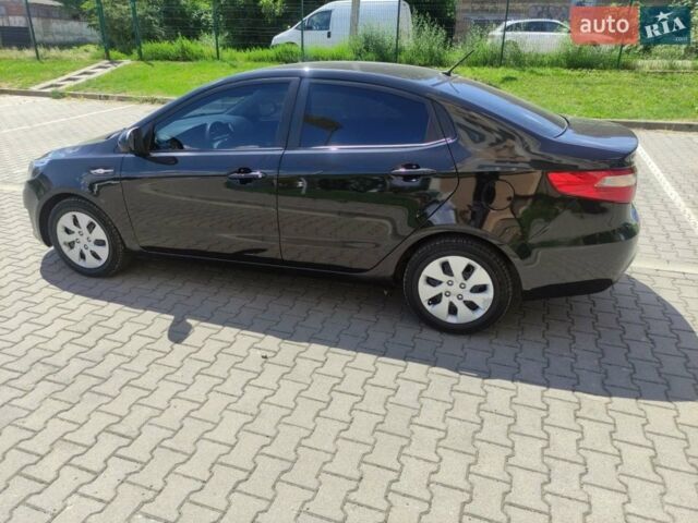 Чорний Кіа Ріо, об'ємом двигуна 1.4 л та пробігом 186 тис. км за 6800 $, фото 2 на Automoto.ua