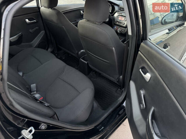 Черный Киа Рио, объемом двигателя 1.4 л и пробегом 305 тыс. км за 4950 $, фото 14 на Automoto.ua