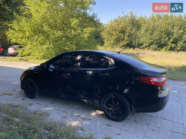 Черный Киа Рио, объемом двигателя 1.59 л и пробегом 194 тыс. км за 6700 $, фото 6 на Automoto.ua