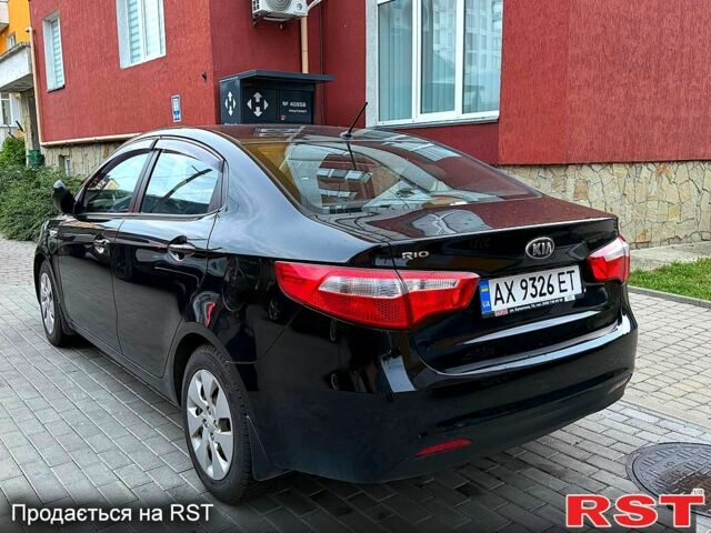 Чорний Кіа Ріо, об'ємом двигуна 1.4 л та пробігом 87 тис. км за 7700 $, фото 3 на Automoto.ua
