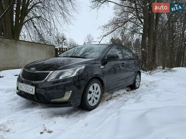 Чорний Кіа Ріо, об'ємом двигуна 1.4 л та пробігом 123 тис. км за 7300 $, фото 1 на Automoto.ua