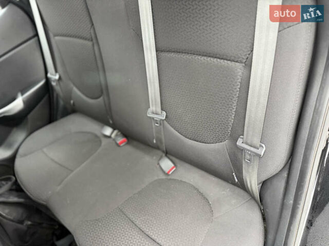 Чорний Кіа Ріо, об'ємом двигуна 1.4 л та пробігом 123 тис. км за 7300 $, фото 12 на Automoto.ua