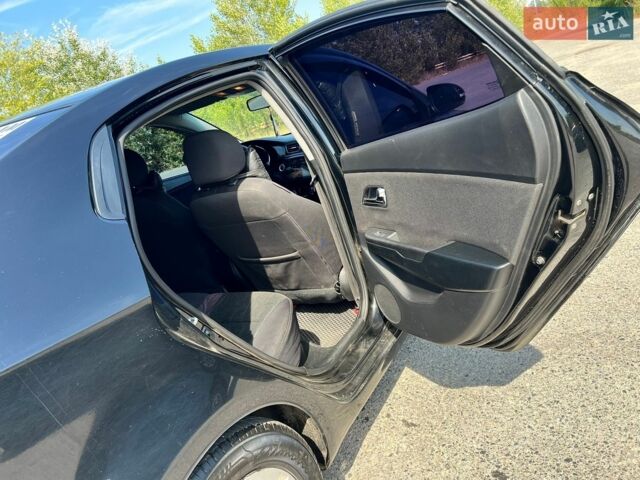 Чорний Кіа Ріо, об'ємом двигуна 1.6 л та пробігом 142 тис. км за 6800 $, фото 8 на Automoto.ua