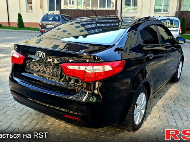 Черный Киа Рио, объемом двигателя 1.6 л и пробегом 130 тыс. км за 8750 $, фото 2 на Automoto.ua