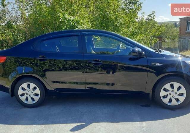 Черный Киа Рио, объемом двигателя 1.4 л и пробегом 121 тыс. км за 8600 $, фото 1 на Automoto.ua