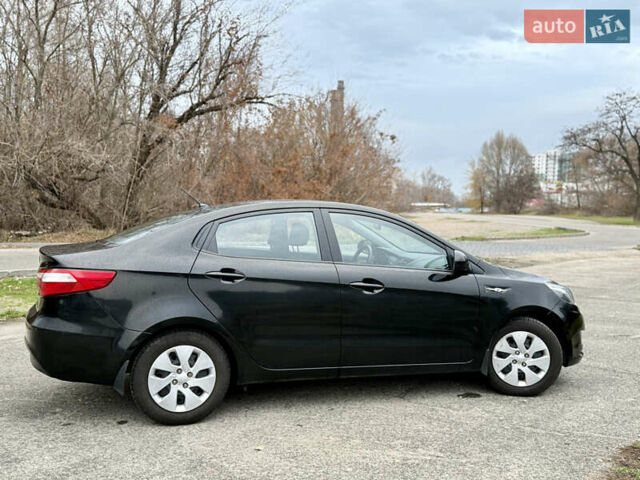 Чорний Кіа Ріо, об'ємом двигуна 1.4 л та пробігом 45 тис. км за 9800 $, фото 5 на Automoto.ua