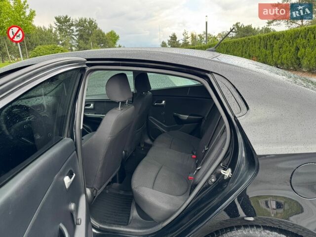 Чорний Кіа Ріо, об'ємом двигуна 1.4 л та пробігом 107 тис. км за 7500 $, фото 8 на Automoto.ua