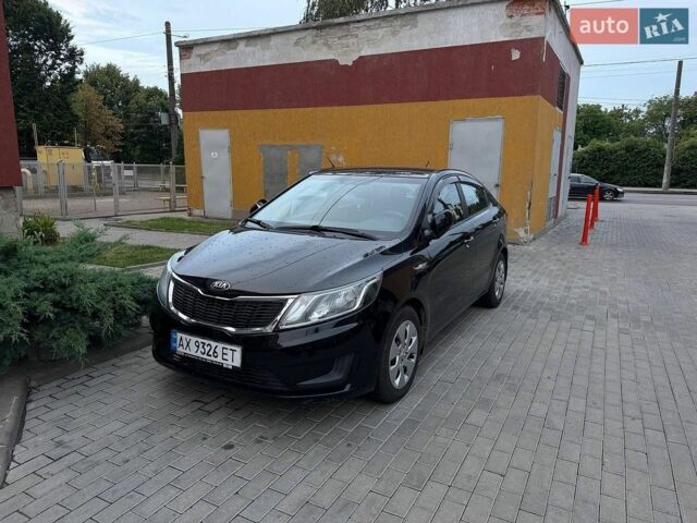 Чорний Кіа Ріо, об'ємом двигуна 1.4 л та пробігом 87 тис. км за 7700 $, фото 1 на Automoto.ua
