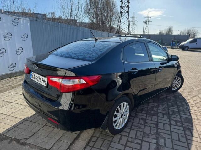 Чорний Кіа Ріо, об'ємом двигуна 1.4 л та пробігом 213 тис. км за 7200 $, фото 2 на Automoto.ua