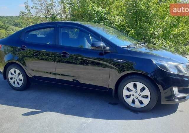 Черный Киа Рио, объемом двигателя 1.4 л и пробегом 121 тыс. км за 8600 $, фото 7 на Automoto.ua