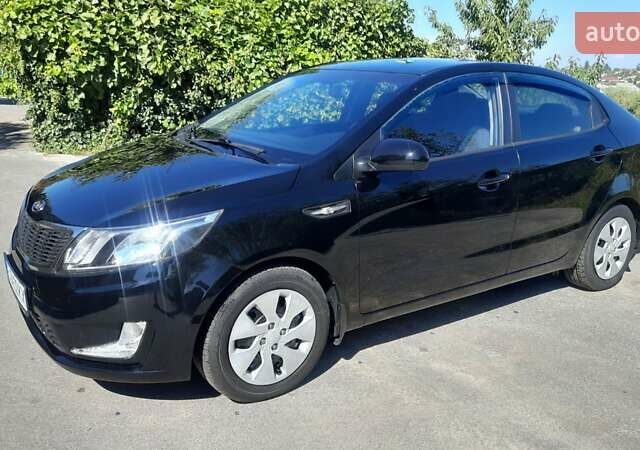 Черный Киа Рио, объемом двигателя 1.4 л и пробегом 121 тыс. км за 8600 $, фото 4 на Automoto.ua