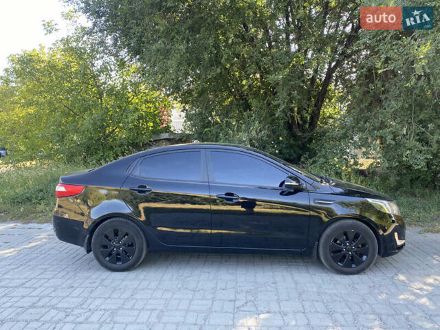 Черный Киа Рио, объемом двигателя 1.59 л и пробегом 194 тыс. км за 6700 $, фото 2 на Automoto.ua