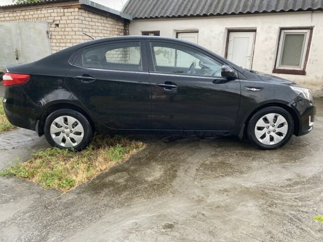 Чорний Кіа Ріо, об'ємом двигуна 1.4 л та пробігом 88 тис. км за 8300 $, фото 3 на Automoto.ua