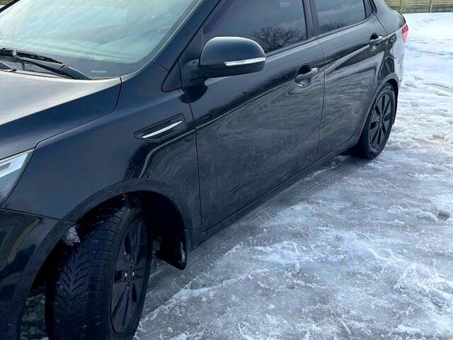 Чорний Кіа Ріо, об'ємом двигуна 1.6 л та пробігом 320 тис. км за 6500 $, фото 6 на Automoto.ua