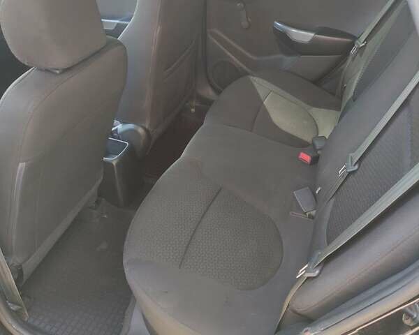 Чорний Кіа Ріо, об'ємом двигуна 1.4 л та пробігом 186 тис. км за 6800 $, фото 5 на Automoto.ua