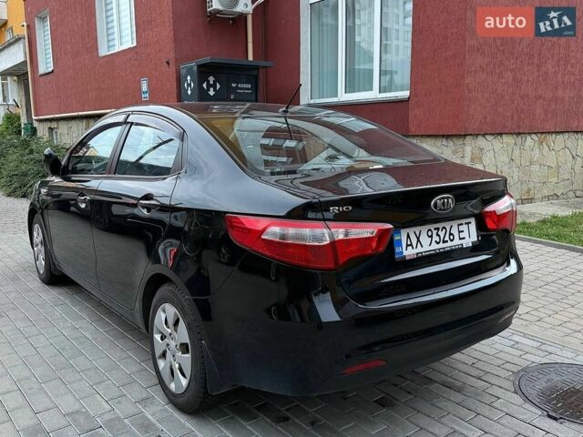 Чорний Кіа Ріо, об'ємом двигуна 1.4 л та пробігом 87 тис. км за 7700 $, фото 4 на Automoto.ua