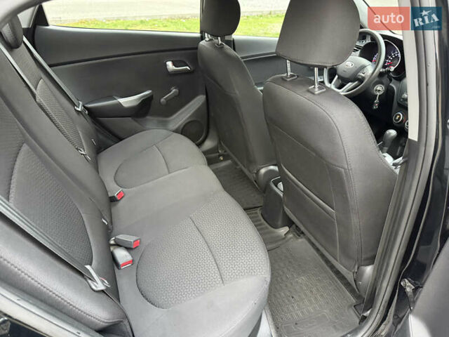 Чорний Кіа Ріо, об'ємом двигуна 1.4 л та пробігом 45 тис. км за 9800 $, фото 25 на Automoto.ua