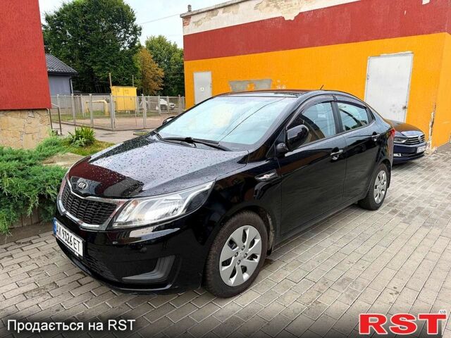 Чорний Кіа Ріо, об'ємом двигуна 1.4 л та пробігом 87 тис. км за 7700 $, фото 1 на Automoto.ua