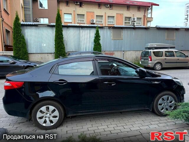 Чорний Кіа Ріо, об'ємом двигуна 1.4 л та пробігом 87 тис. км за 7700 $, фото 5 на Automoto.ua