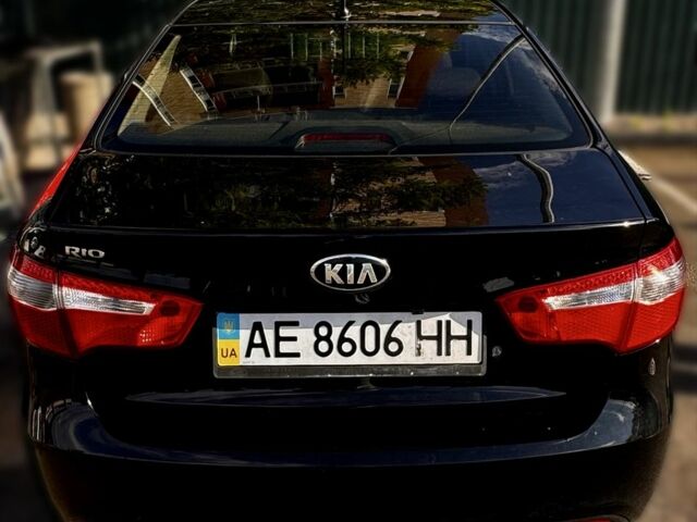 Чорний Кіа Ріо, об'ємом двигуна 1.4 л та пробігом 73 тис. км за 9000 $, фото 1 на Automoto.ua