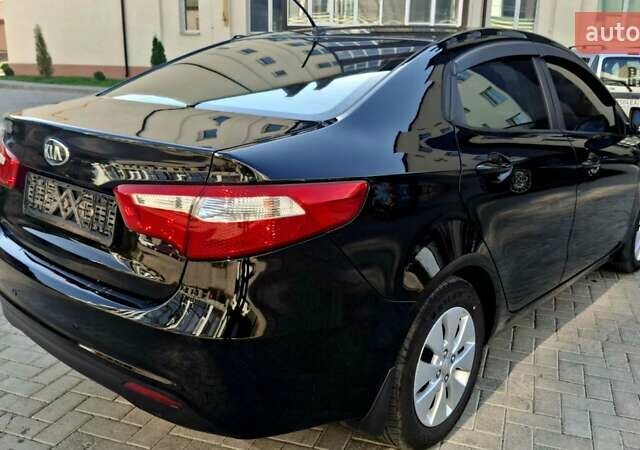Черный Киа Рио, объемом двигателя 1.6 л и пробегом 130 тыс. км за 8750 $, фото 2 на Automoto.ua