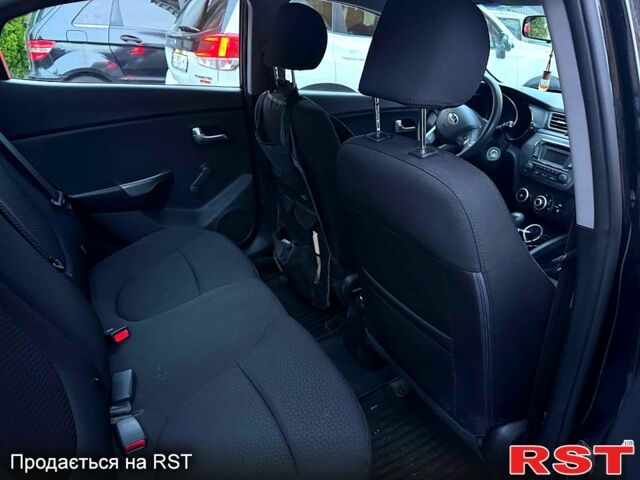 Чорний Кіа Ріо, об'ємом двигуна 1.4 л та пробігом 87 тис. км за 7700 $, фото 12 на Automoto.ua