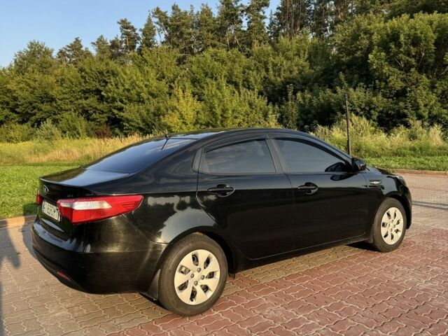 Черный Киа Рио, объемом двигателя 1.4 л и пробегом 185 тыс. км за 5777 $, фото 1 на Automoto.ua