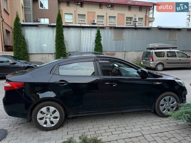 Чорний Кіа Ріо, об'ємом двигуна 1.4 л та пробігом 87 тис. км за 7700 $, фото 3 на Automoto.ua