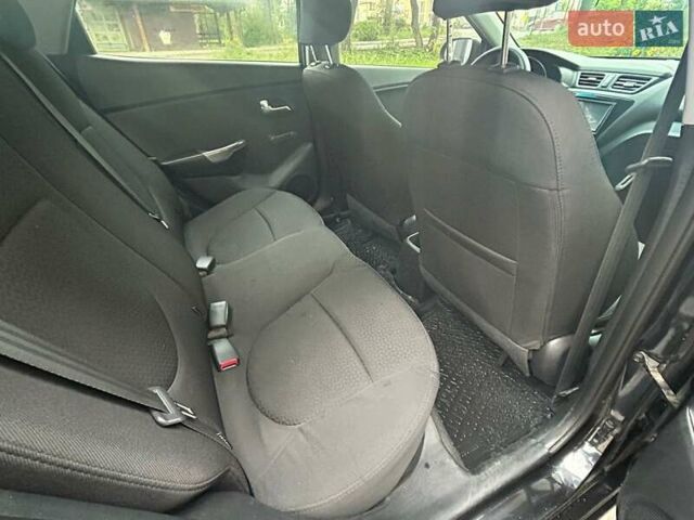 Чорний Кіа Ріо, об'ємом двигуна 1.4 л та пробігом 141 тис. км за 7200 $, фото 10 на Automoto.ua