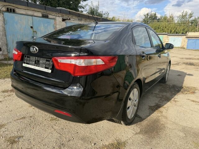 Чорний Кіа Ріо, об'ємом двигуна 1.6 л та пробігом 61 тис. км за 10351 $, фото 6 на Automoto.ua