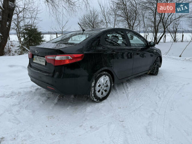 Чорний Кіа Ріо, об'ємом двигуна 1.4 л та пробігом 123 тис. км за 7300 $, фото 3 на Automoto.ua