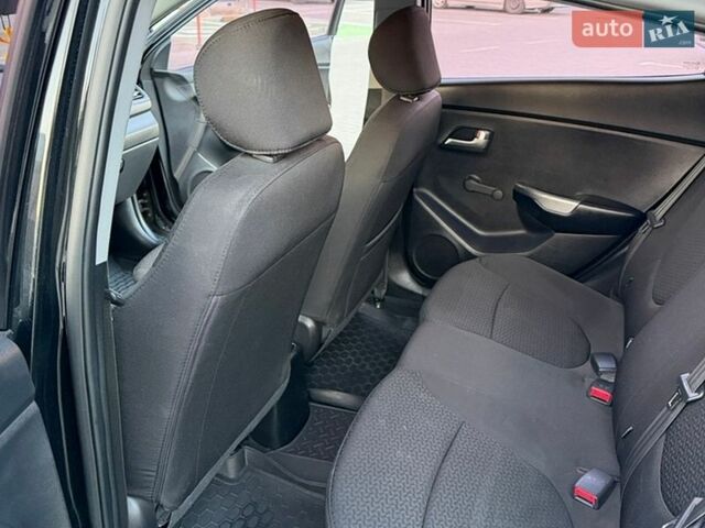 Черный Киа Рио, объемом двигателя 1.4 л и пробегом 90 тыс. км за 9000 $, фото 6 на Automoto.ua