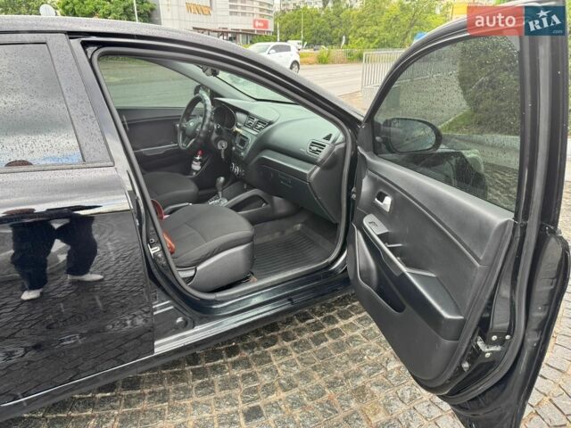 Чорний Кіа Ріо, об'ємом двигуна 1.4 л та пробігом 107 тис. км за 7500 $, фото 7 на Automoto.ua
