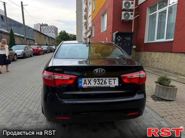 Чорний Кіа Ріо, об'ємом двигуна 1.4 л та пробігом 87 тис. км за 7700 $, фото 4 на Automoto.ua