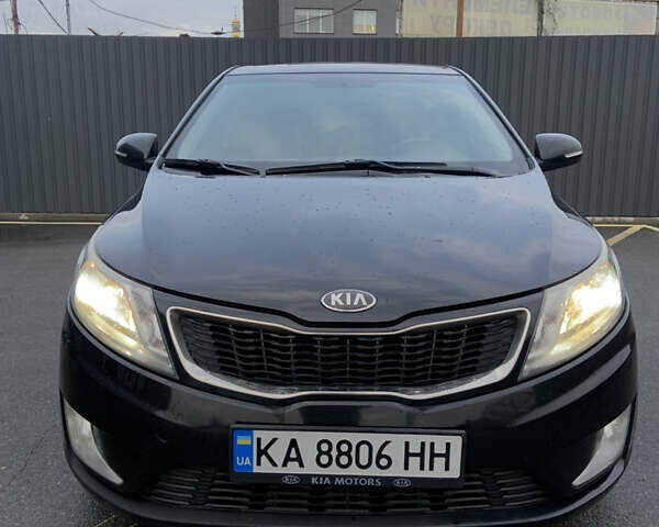 Чорний Кіа Ріо, об'ємом двигуна 1.6 л та пробігом 261 тис. км за 7650 $, фото 1 на Automoto.ua