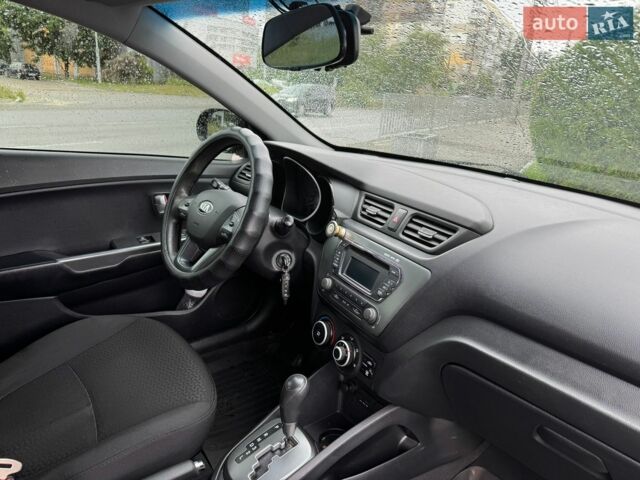 Чорний Кіа Ріо, об'ємом двигуна 1.4 л та пробігом 107 тис. км за 7500 $, фото 6 на Automoto.ua