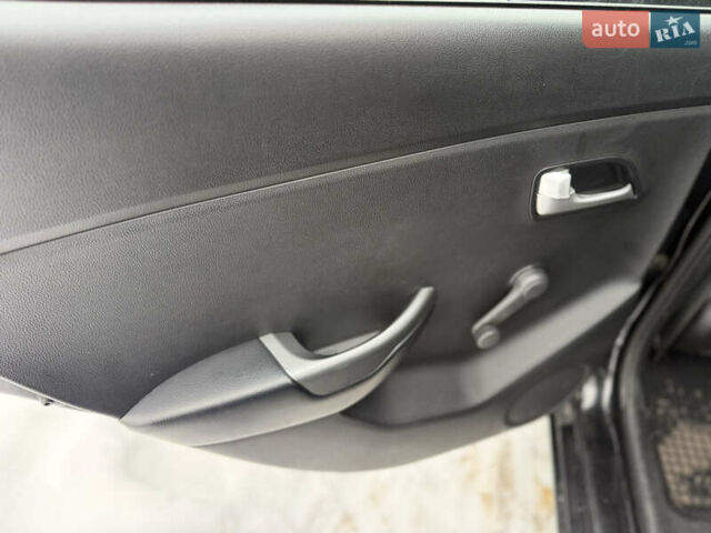 Чорний Кіа Ріо, об'ємом двигуна 1.4 л та пробігом 123 тис. км за 7300 $, фото 11 на Automoto.ua