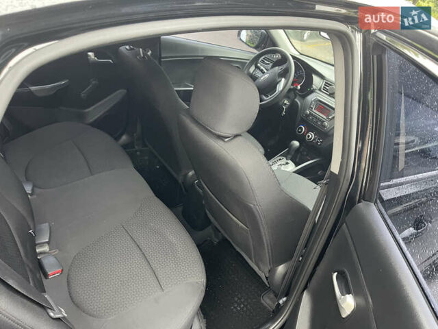 Чорний Кіа Ріо, об'ємом двигуна 1.4 л та пробігом 136 тис. км за 7950 $, фото 24 на Automoto.ua