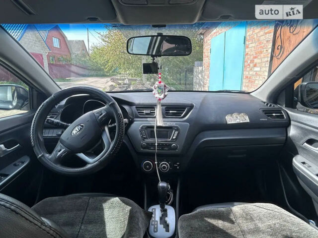 Чорний Кіа Ріо, об'ємом двигуна 1.4 л та пробігом 86 тис. км за 7400 $, фото 5 на Automoto.ua