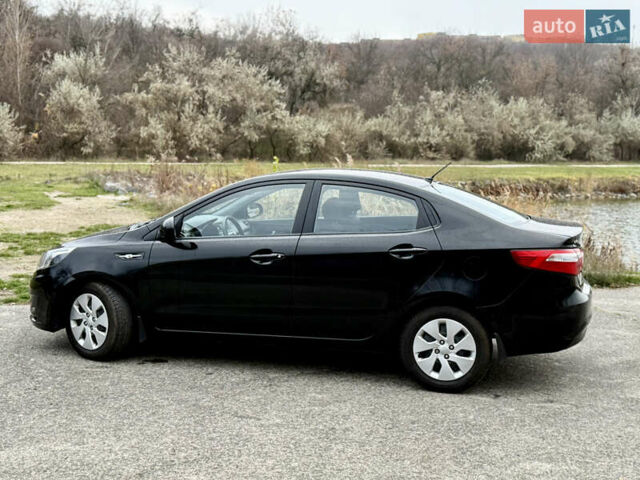 Чорний Кіа Ріо, об'ємом двигуна 1.4 л та пробігом 45 тис. км за 9800 $, фото 10 на Automoto.ua
