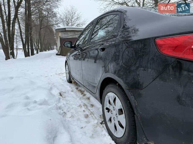 Чорний Кіа Ріо, об'ємом двигуна 1.4 л та пробігом 123 тис. км за 7300 $, фото 4 на Automoto.ua