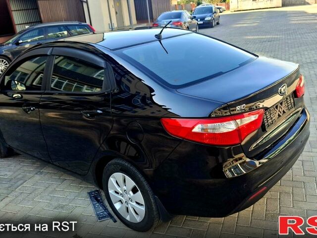 Черный Киа Рио, объемом двигателя 1.6 л и пробегом 130 тыс. км за 8750 $, фото 3 на Automoto.ua