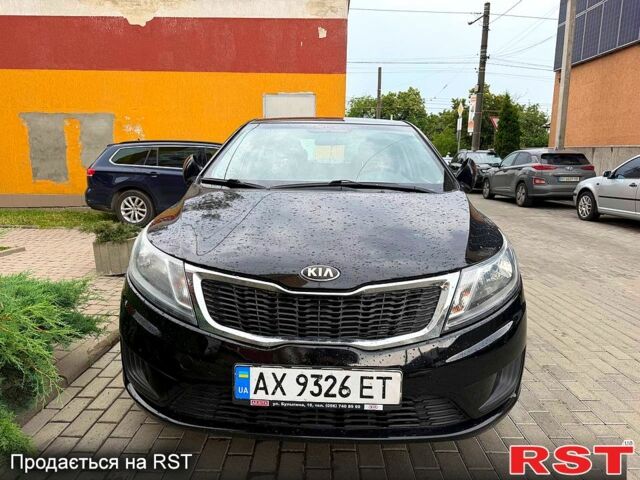 Чорний Кіа Ріо, об'ємом двигуна 1.4 л та пробігом 87 тис. км за 7700 $, фото 2 на Automoto.ua